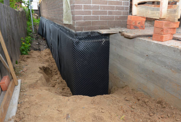 Happy homeowners after waterproofing job in Honeoye